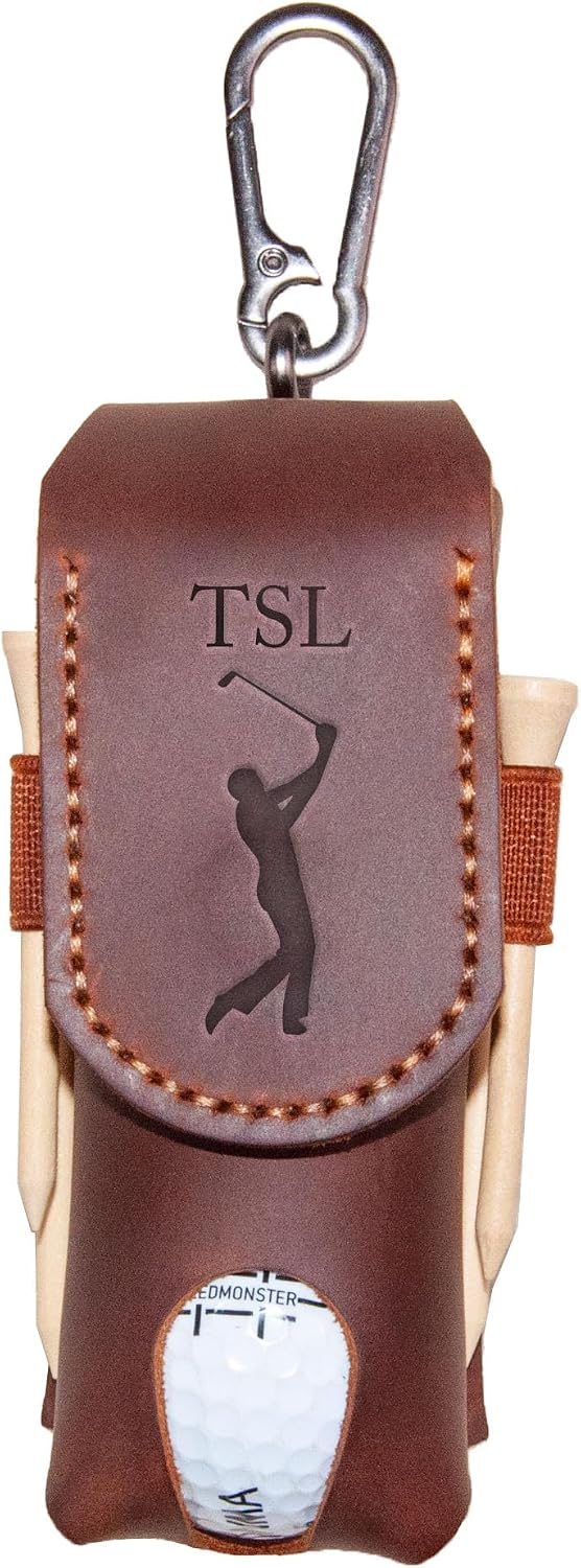 Brown leather golf accessory holder with tees, a ball, and a carabiner clip.